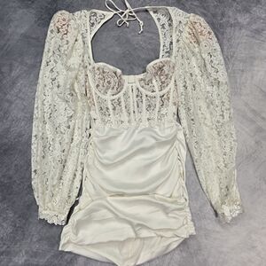 For Love & Lemons Lacey Mini Dress in white, featuring sheer lace sleeves